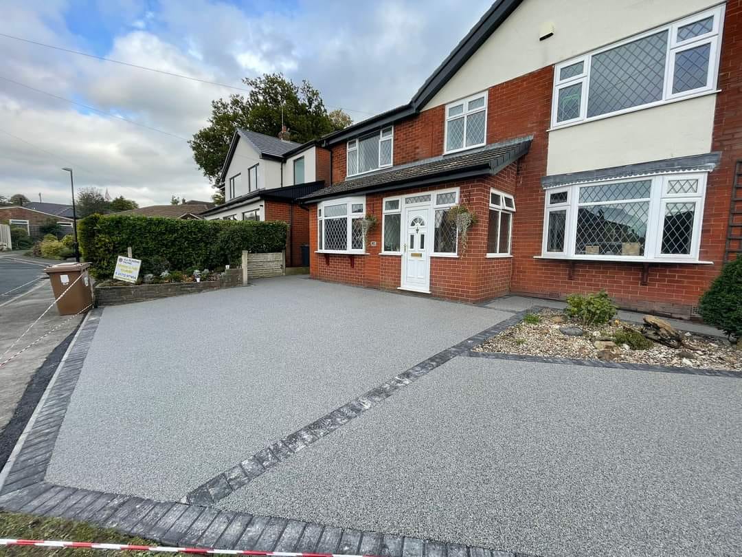 A modern grey resin-bound driveway laid by Hertsmere Driveways